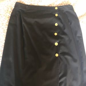 AUTHENTIC CHANEL bi-fold skirt in black.